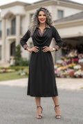 Vestido Midi Elegante Negro con Detalles de Animal Print en Cuello y Puños
